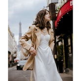 Tailored longline silk blazer with sharp lapels and structured silhouette for elevated styling